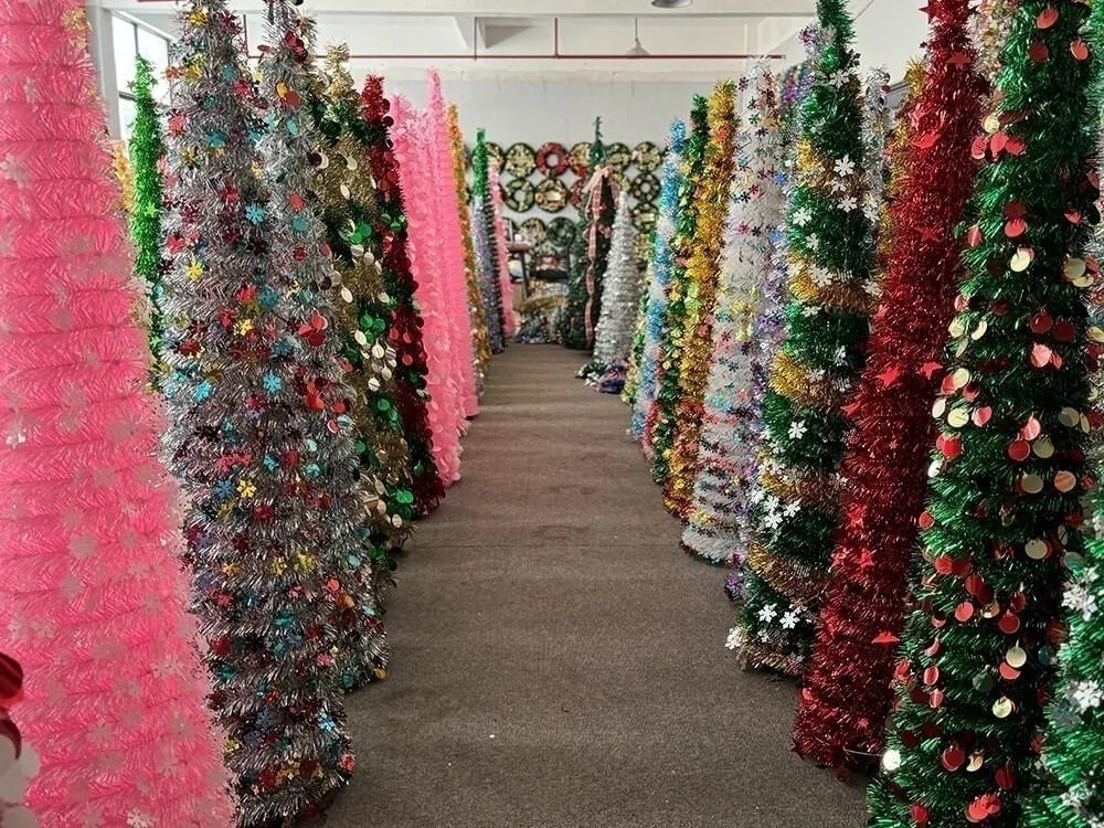 Colorful tinsel Christmas trees in the Christmasever showroom